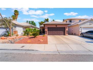 Charming single-story home with desert landscaping and a two-car garage at 5978 Autumn Harvest Ave, Las Vegas, NV 89142