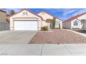 Charming single-story home with low-maintenance desert landscaping and a two-car garage at 6222 Eliza Ln, North Las Vegas, NV 89031