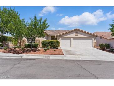Charming single-story home with a well-maintained lawn and a two-car garage, located in a quiet neighborhood at 8114 Lapis Harbor Ave, Las Vegas, NV 89117