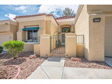 Charming single-story home featuring a well-maintained landscape with a quaint gated entrance at 8929 Marble Dr, Las Vegas, NV 89134
