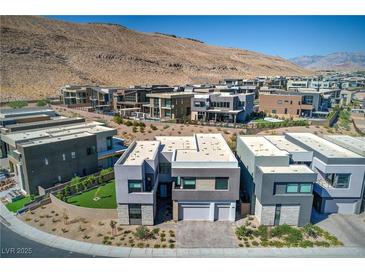 Modern two-story home featuring a two-car garage, contemporary design, and desert landscaping at 5429 Succulent Rose Dr, Las Vegas, NV 89135