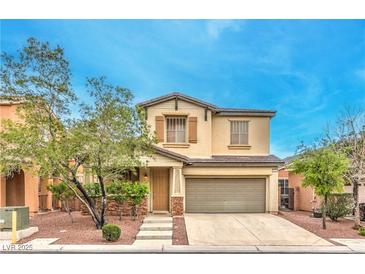 Charming two-story home with a well-maintained front yard and two-car garage at 6554 Macdoogle St, Las Vegas, NV 89166