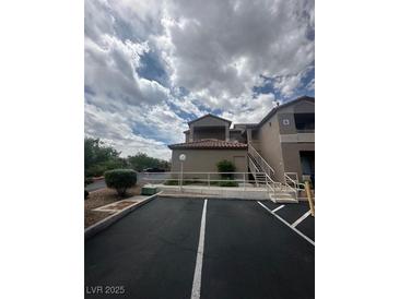 Condo complex exterior with landscaped grounds and assigned parking spaces available at 75 N Valle Verde Dr # 625, Henderson, NV 89074