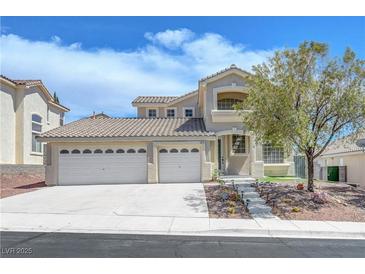 Charming two-story home features a three-car garage and drought resistant landscaping at 3079 Evening Mist Ave, Henderson, NV 89052