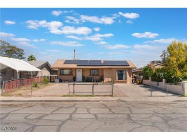 Charming single-story home with a fenced yard, solar panels, and a private driveway at 3112 Twining Ave, North Las Vegas, NV 89030