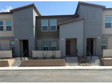 Stylish townhome featuring a neutral color scheme, modern architectural details, and an inviting entrance at 3762 Sonrisa Vista Ave, Henderson, NV 89044