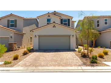 Charming two-story home featuring a two-car garage, landscaped yard, and inviting curb appeal at 4517 Swimming Minnow Ave, Las Vegas, NV 89141