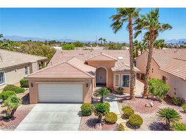 Charming single-story home features desert landscaping, an attached two-car garage, and a tiled roof at 5078 Rivedro St, Las Vegas, NV 89135