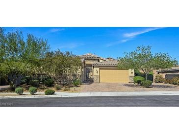 Charming single-story home features a two-car garage, beautiful desert landscaping, and gated entry at 6975 Hopi Summit Ct, Las Vegas, NV 89149