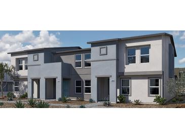 Contemporary townhome showcasing a modern facade, landscaped front yard, and private entrances at 9330 Soothing Sea St # Lot 92, Las Vegas, NV 89178