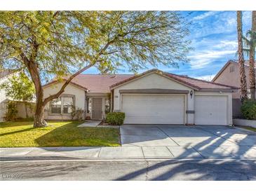 Charming single story home with a three car garage and well maintained front yard at 1793 Clear River Falls Ln, Henderson, NV 89012