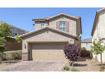 Charming two-story home with a brick driveway and well-maintained landscaping at 2827 Turnstone Ridge St, Henderson, NV 89044