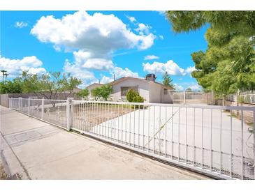 Charming single-story home featuring a secure fenced yard and well-lit driveway at 45 Prince Ln, Las Vegas, NV 89110