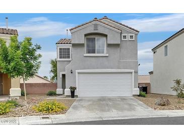 Inviting two-story home featuring a neutral color palette, two-car garage and low maintenance landscaping at 4820 Integrity St, North Las Vegas, NV 89031