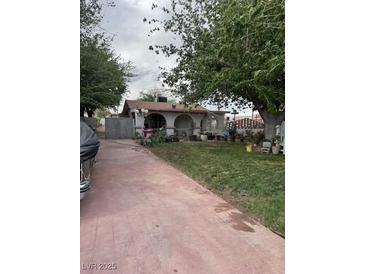 Charming single-story home featuring a spacious front yard and inviting curb appeal at 4834 E Van Buren Ave, Las Vegas, NV 89110