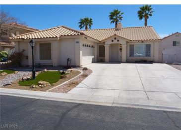 Charming single-story home with a tile roof, desert landscaping, and an attached two-car garage at 6508 Alpine Forest Ct, Las Vegas, NV 89149