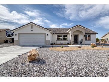 Charming single-story home with gravel landscaping and a two-car garage at 681 Indian Wells Ct, Pahrump, NV 89060