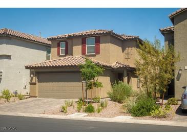 Charming two-story home featuring a two-car garage and desert landscaping in a quiet neighborhood at 10352 Rye Patch Creek St, Las Vegas, NV 89141