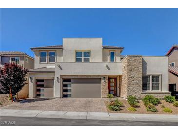 Stunning two-story home with a three-car garage and manicured front yard at 2579 Speyburn Ave, Henderson, NV 89044