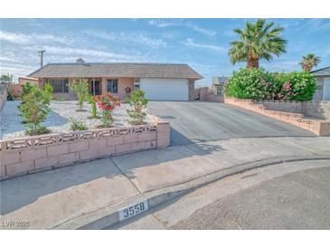 Charming single-story home with a well-maintained front yard and long driveway at 3558 Wayne Cir, Las Vegas, NV 89121