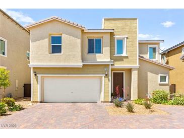 Charming two-story home with a well-maintained front yard and attached garage at 7189 Ashcroft St, North Las Vegas, NV 89084