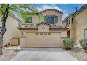 Charming two-story home featuring a two-car garage and a well-maintained front yard at 6549 Butterfly Sky St, North Las Vegas, NV 89084
