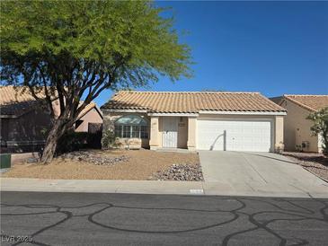 Charming single-story home featuring a well-maintained yard and inviting curb appeal at 734 Rusty Spur Dr, Henderson, NV 89014