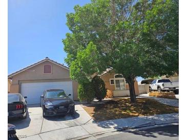 Charming single story home with a two car garage and mature landscaping in a desirable neighborhood at 2631 Bed Knoll Ct, North Las Vegas, NV 89031