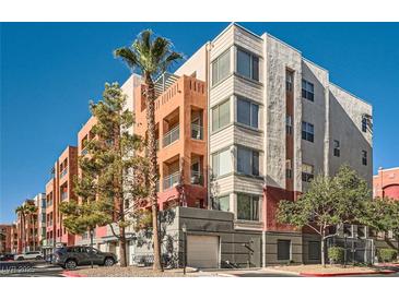 Beautiful multi-story building with modern architectural details and a blue sky at 55 E Agate Ave # 202, Las Vegas, NV 89123