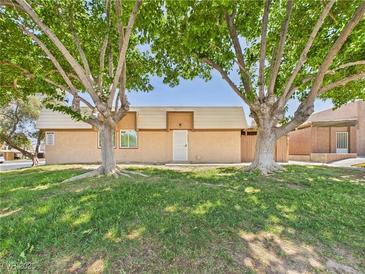 Charming single-story home with well-maintained lawn and mature trees at 3654 Villa Knolls South Dr, Las Vegas, NV 89120