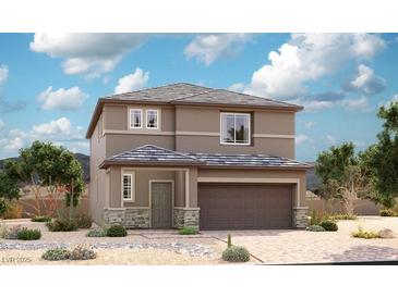 Charming two-story home with a two car garage and stone accents on the front facade at 929 Hunter Shores Ave, North Las Vegas, NV 89084