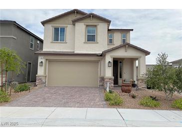 Charming two-story home with a neutral color palette, landscaped yard, and a two car garage at 933 Hunter Shores Ave, North Las Vegas, NV 89084
