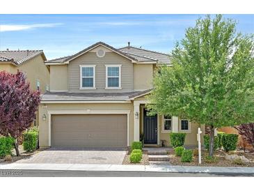 Charming two-story home featuring a two-car garage and a well-maintained, landscaped front yard at 3171 Biccari Ave, Henderson, NV 89044