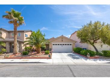Charming single-story home with well-manicured landscaping and a two-car garage at 5017 Hadley Meadow Ct, Las Vegas, NV 89131