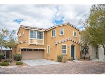 Inviting two-story home showcasing neutral stucco and a convenient attached two-car garage at 8368 Creek Canyon Ave, Las Vegas, NV 89113