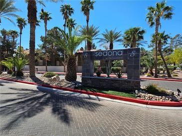Community entrance with manicured landscaping, palm trees, and attractive Sedona on the Boulevard signage at 9000 Las Vegas Blvd # 2097, Las Vegas, NV 89123
