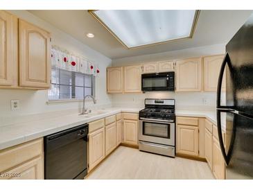 Well-lit kitchen featuring stainless steel appliances and light wood cabinets at 2851 S Valley View Blvd # 1161, Las Vegas, NV 89102