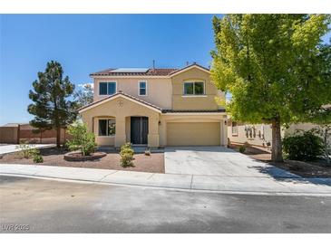 Charming two-story home featuring a well-manicured yard and a spacious two-car garage at 3809 Alpine Track Ave, North Las Vegas, NV 89032