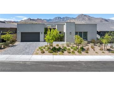 Contemporary home featuring modern architectural elements, a two-car garage, and desert landscaping at 787 Willits St, Las Vegas, NV 89138