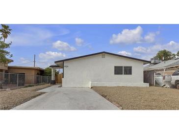 Charming single-story home featuring a well-maintained yard and a classic architectural style at 1424 Balzar Ave, Las Vegas, NV 89106