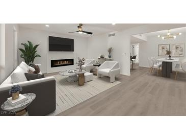 Bright living room featuring modern furniture, fireplace, and an open layout connecting to the dining area at 3667 Mckinley Ave, Las Vegas, NV 89121