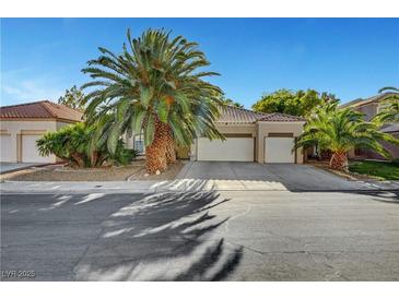Charming single-story home featuring a three-car garage, mature landscaping, and a well-maintained front yard at 5305 Bright Sun Ct, Las Vegas, NV 89130