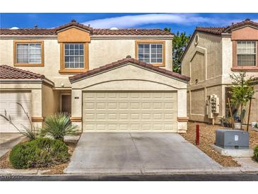 Charming townhome featuring a two-car garage and well-maintained landscaping at 5330 E Charleston Blvd # 28, Las Vegas, NV 89142