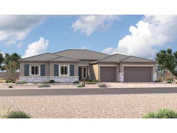 Charming single-story home featuring a neutral color palette, stone accents, and a two-car garage at 5411 Meranto Ave, Las Vegas, NV 89139