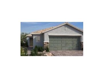 Charming single-story home featuring a neutral color scheme, desert landscaping and a two-car garage at 5941 Violet Crown St, North Las Vegas, NV 89081