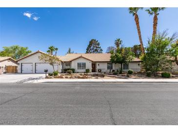 Charming single-story home featuring a well-maintained yard and two-car garage in a serene neighborhood at 6517 W Brooks Ave, Las Vegas, NV 89108