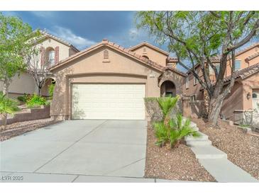 Charming single-Gathering home with a two-car garage and desert landscaping at 776 Anacapri St, Las Vegas, NV 89138