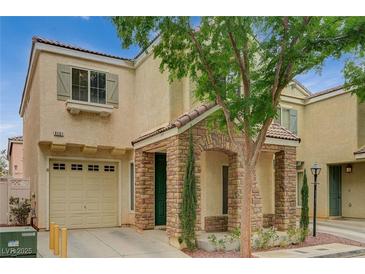 Charming home featuring a stone-accented entrance, desert landscaping, and a attached one-car garage at 8261 Golden Flowers St, Las Vegas, NV 89139