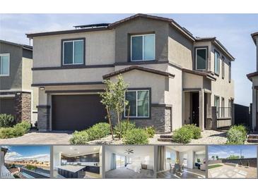 Two-story home featuring desert landscaping, stone accents, and a dark brown two-car garage at 9732 Abel Cliff St, Las Vegas, NV 89143
