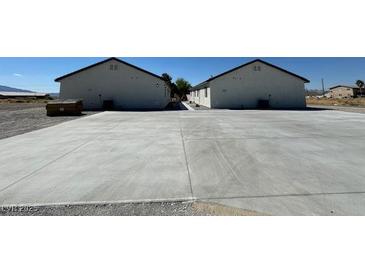 Newly built residential units featuring expansive parking and modern architecture at 1060 Hall Ave, Pahrump, NV 89048